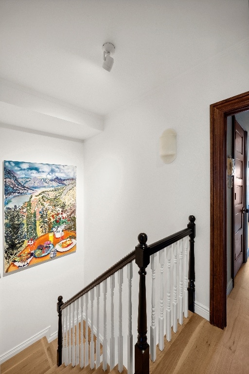 staircase featuring hardwood / wood-style flooring