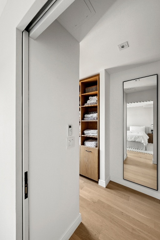 hallway featuring light hardwood / wood-style floors