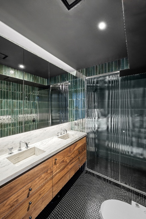 bathroom with vanity, toilet, and tile patterned flooring