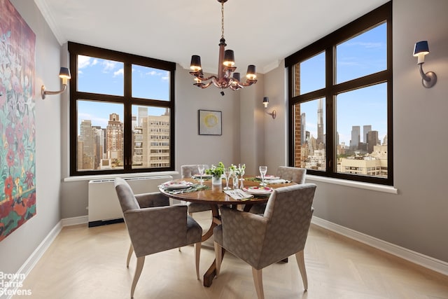 dining room featuring light parquet floors, a wealth of natural light, and a notable chandelier