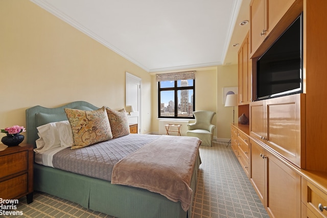 bedroom with ornamental molding and carpet