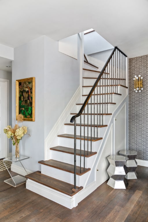 staircase with hardwood / wood-style flooring