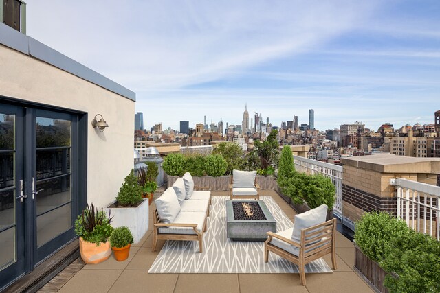 2 Cornelia St Pha, Pha, New York City, NY 10014 - view of patio / terrace with a skyline view, an outdoor living space with a fire pit, and a balcony