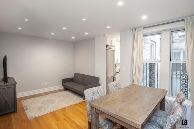 dining area with light hardwood / wood-style floors