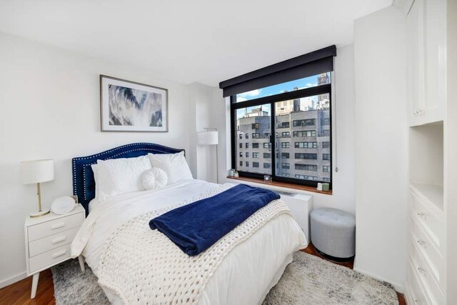 bedroom featuring wood-type flooring