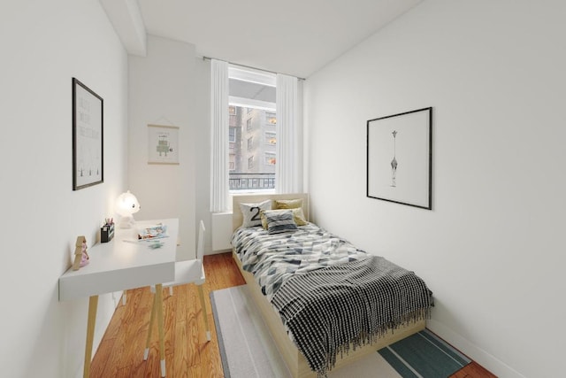 bedroom featuring hardwood / wood-style flooring