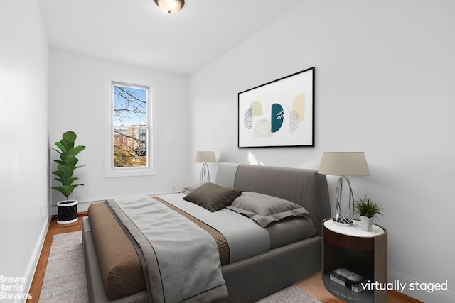 bedroom with hardwood / wood-style flooring