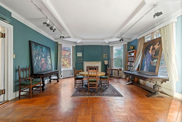 dining area featuring parquet flooring, rail lighting, and an AC wall unit