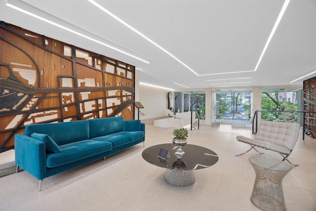 living room with a wall of windows and light tile patterned flooring