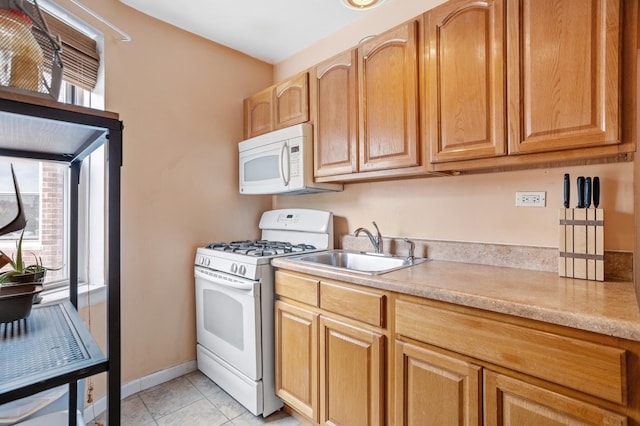 800 Grand Concourse Unit 3-Ks, New York City, NY 10451 - kitchen featuring white appliances, light countertops, a sink, and light tile patterned flooring