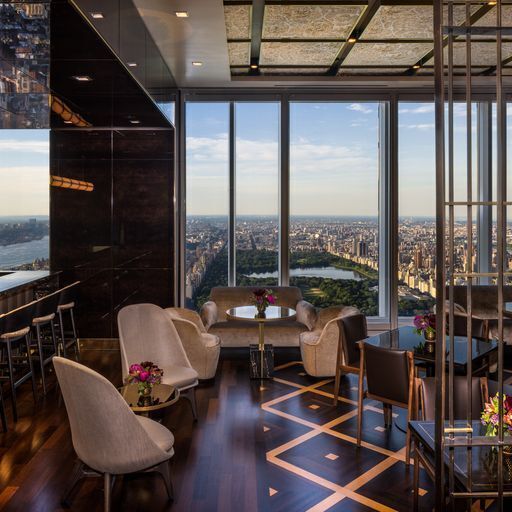 dining room featuring floor to ceiling windows and wood-type flooring