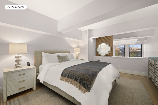 bedroom featuring dark hardwood / wood-style flooring