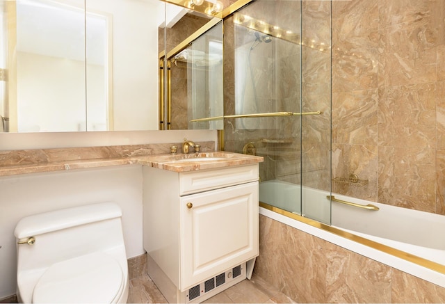 full bath with toilet, visible vents, bath / shower combo with glass door, and vanity