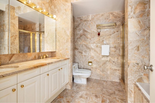 full bathroom featuring toilet, vanity, shower with separate bathtub, and tile walls