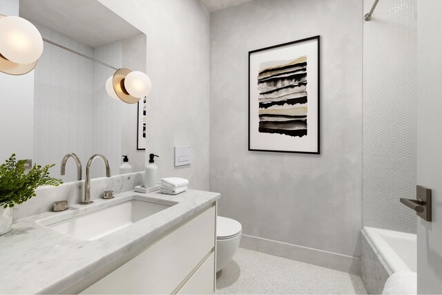full bathroom featuring vanity, toilet, baseboards, walk in shower, and speckled floor