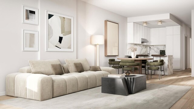 living room featuring baseboards and light wood-style floors