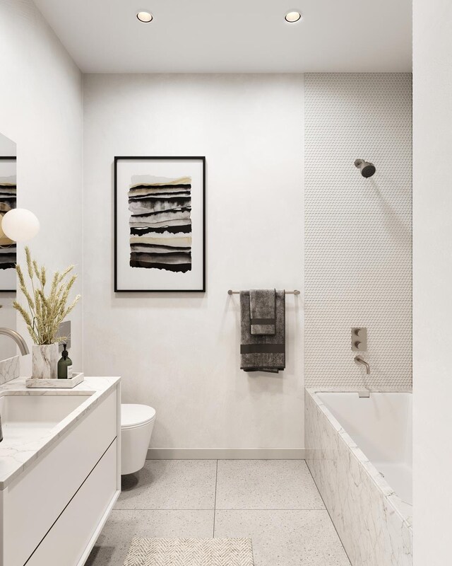 bathroom featuring baseboards, toilet, recessed lighting, vanity, and speckled floor