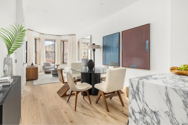 dining space featuring light wood-style floors