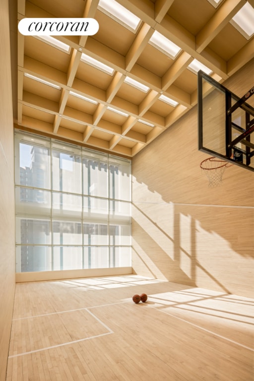 staircase featuring coffered ceiling and beam ceiling