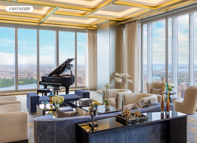 interior space with coffered ceiling, floor to ceiling windows, and a water view