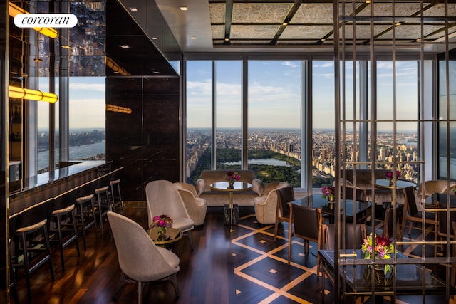 dining space featuring hardwood / wood-style flooring and floor to ceiling windows