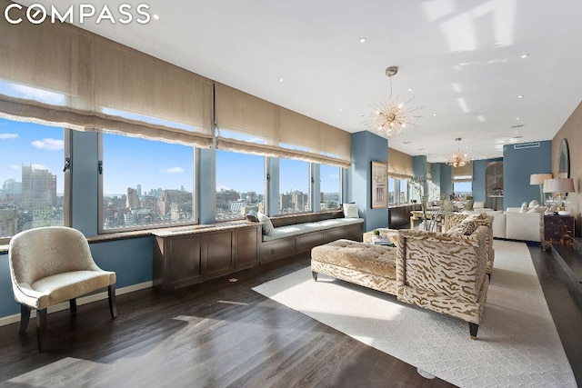 living room with a notable chandelier and dark hardwood / wood-style floors