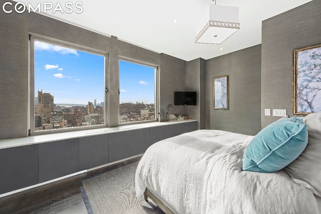 bedroom featuring dark hardwood / wood-style flooring