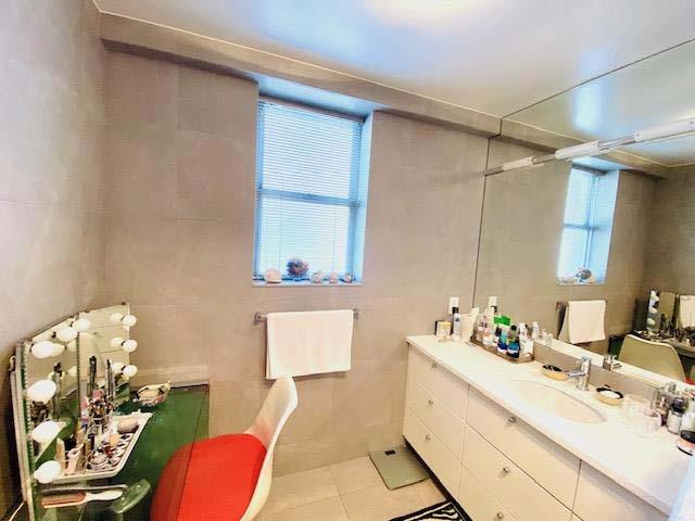 bathroom with tile patterned flooring and vanity