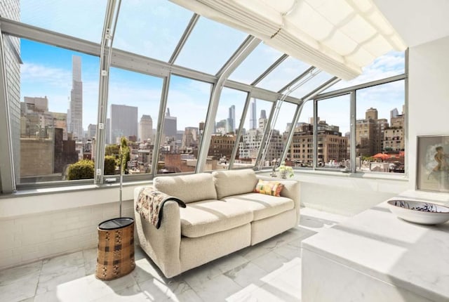 sunroom featuring a city view