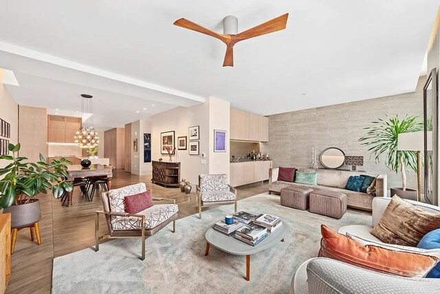 living room featuring light hardwood / wood-style floors and a chandelier