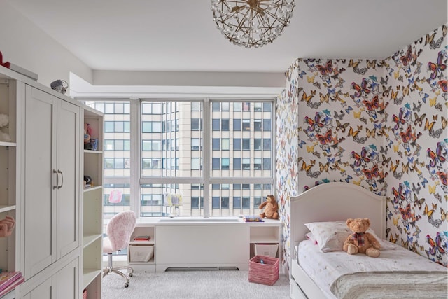 bedroom featuring a notable chandelier, carpet flooring, and wallpapered walls