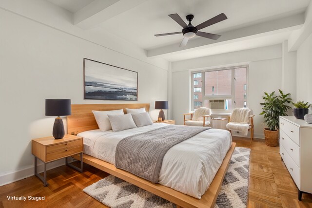 bedroom with ceiling fan, parquet flooring, cooling unit, and beam ceiling