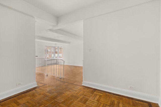 unfurnished room featuring parquet flooring