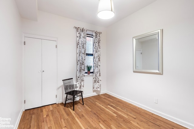 405 E 82nd St Unit 2H, New York City, NY 10028 - bedroom with light wood-style flooring, baseboards, and a closet