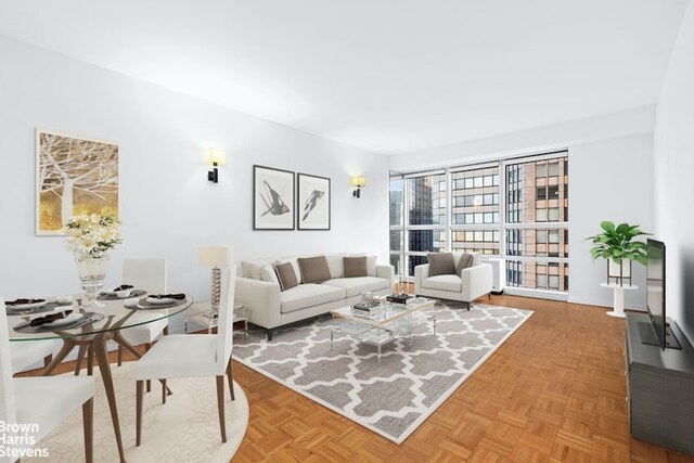 living room with parquet flooring