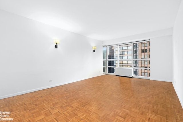 spare room with light parquet flooring