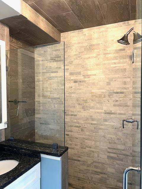 240 E 35th St Unit 9A, New York City, NY 10016 - bathroom featuring vanity and a tile shower