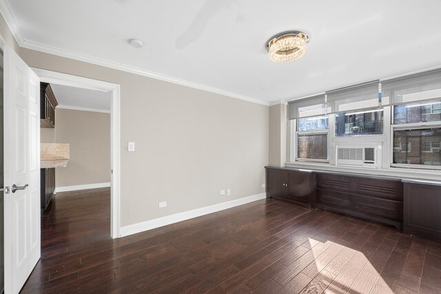 240 E 35th St Unit 9A, New York City, NY 10016 - unfurnished room with crown molding, baseboards, and dark wood-style floors