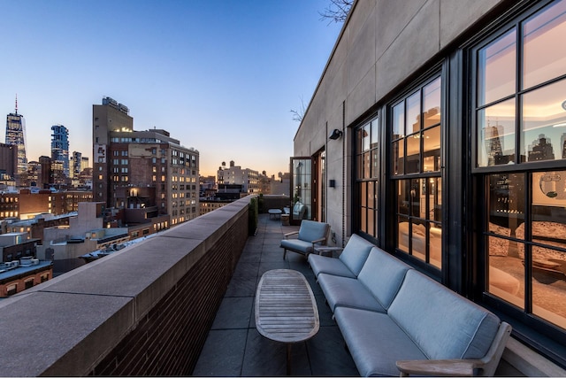 balcony featuring an outdoor hangout area and a view of city