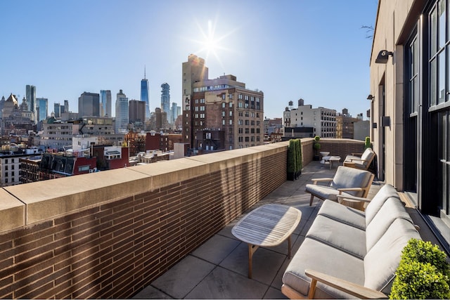 balcony featuring a view of city