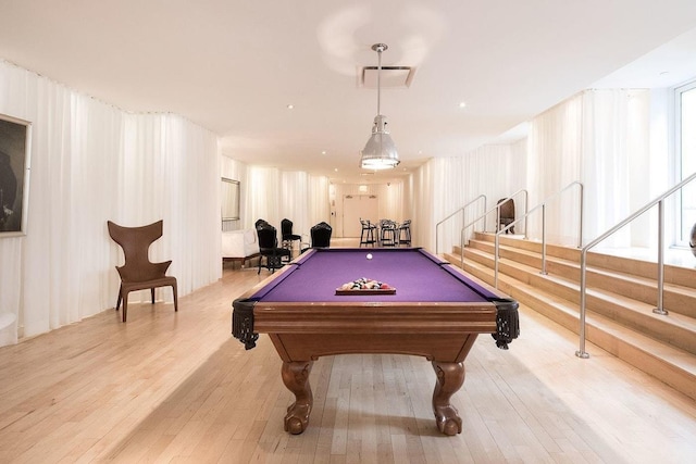 game room with visible vents, pool table, and wood finished floors