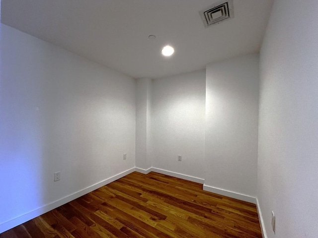 spare room featuring dark hardwood / wood-style floors