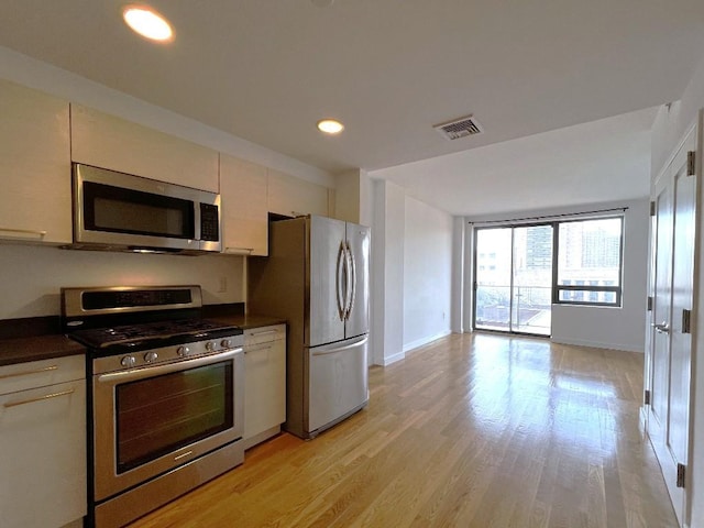 kitchen featuring stainless steel appliances and light wood-type flooring