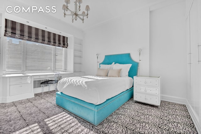 bedroom featuring baseboards and a notable chandelier