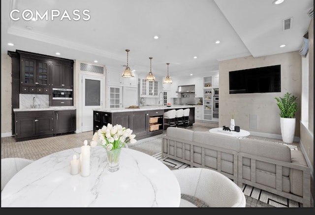 dining space featuring baseboards, recessed lighting, visible vents, and ornamental molding