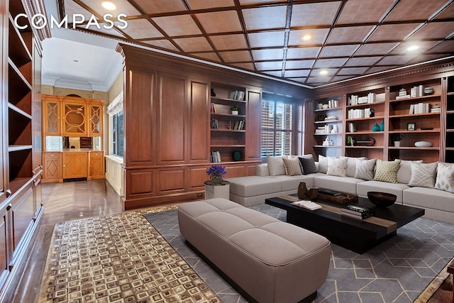 living area with built in shelves, coffered ceiling, and ornamental molding