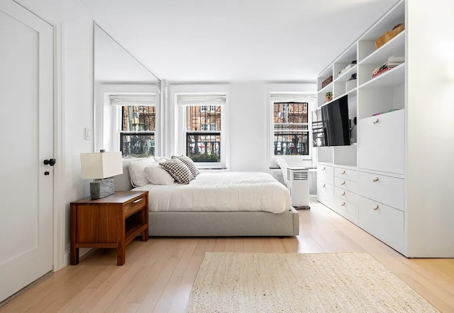 bedroom with light hardwood / wood-style flooring