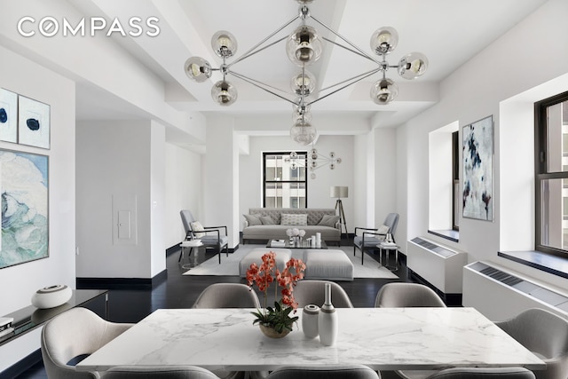 20 Pine St Unit 3204, New York City, NY 10005 - dining area featuring wood finished floors, baseboards, and a chandelier
