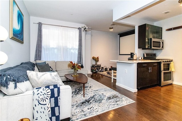 52 3rd Ave Unit 1A, New York City, NY 11217 - living area with dark wood-style floors and baseboards