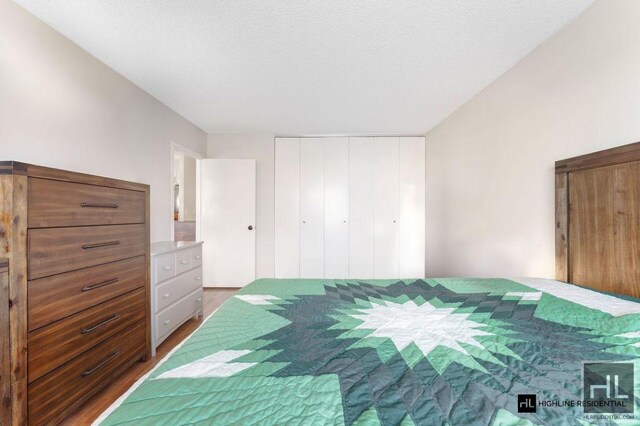 unfurnished bedroom with a closet and a textured ceiling